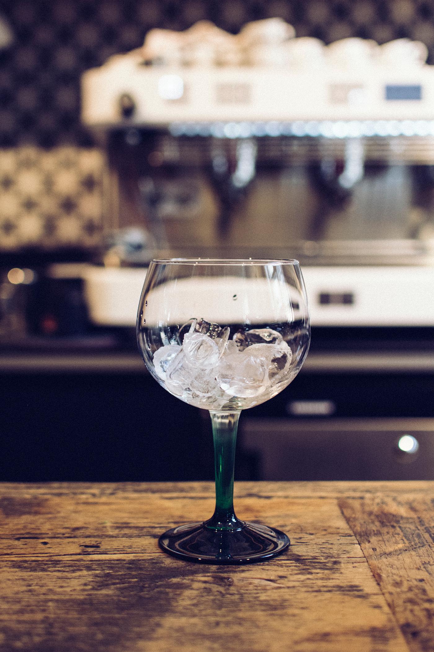 Empty glass with ice in a bar Empty glass with ice in a bar