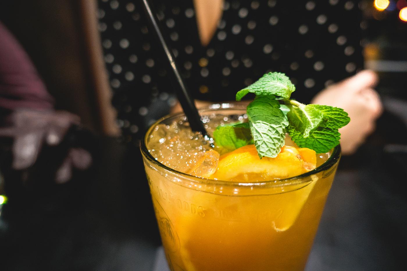 Orange juice decorated with mint leaf Orange juice decorated with mint leaf