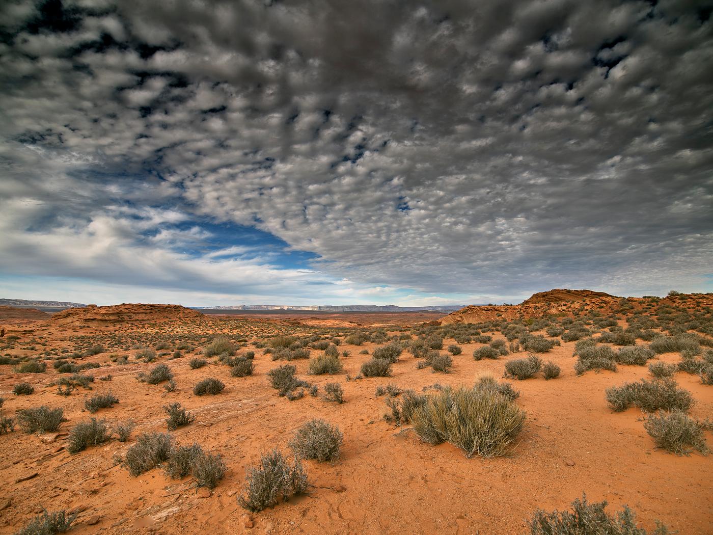 Cotton ball-like clouds drift over the remote terrain near the northern Arizona town of Page. Original image from Carol M.... Cotton ball-like clouds drift over the remote terrain near the northern Arizona town of Page. Original image from Carol M....