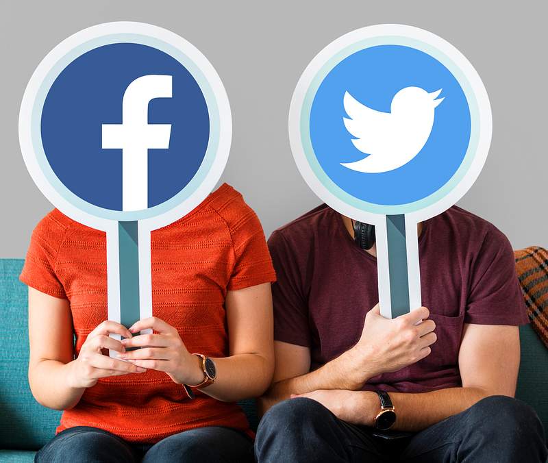 Couple holding social media icons 