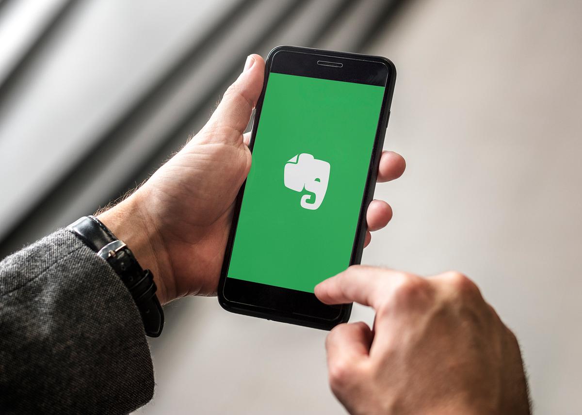 businessman using evernote application