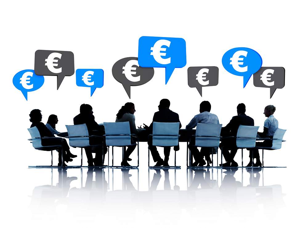 Silhouette of people in a meeting talking about euros 