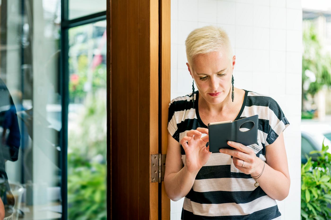 Woman texting on her phone Woman texting on her phone