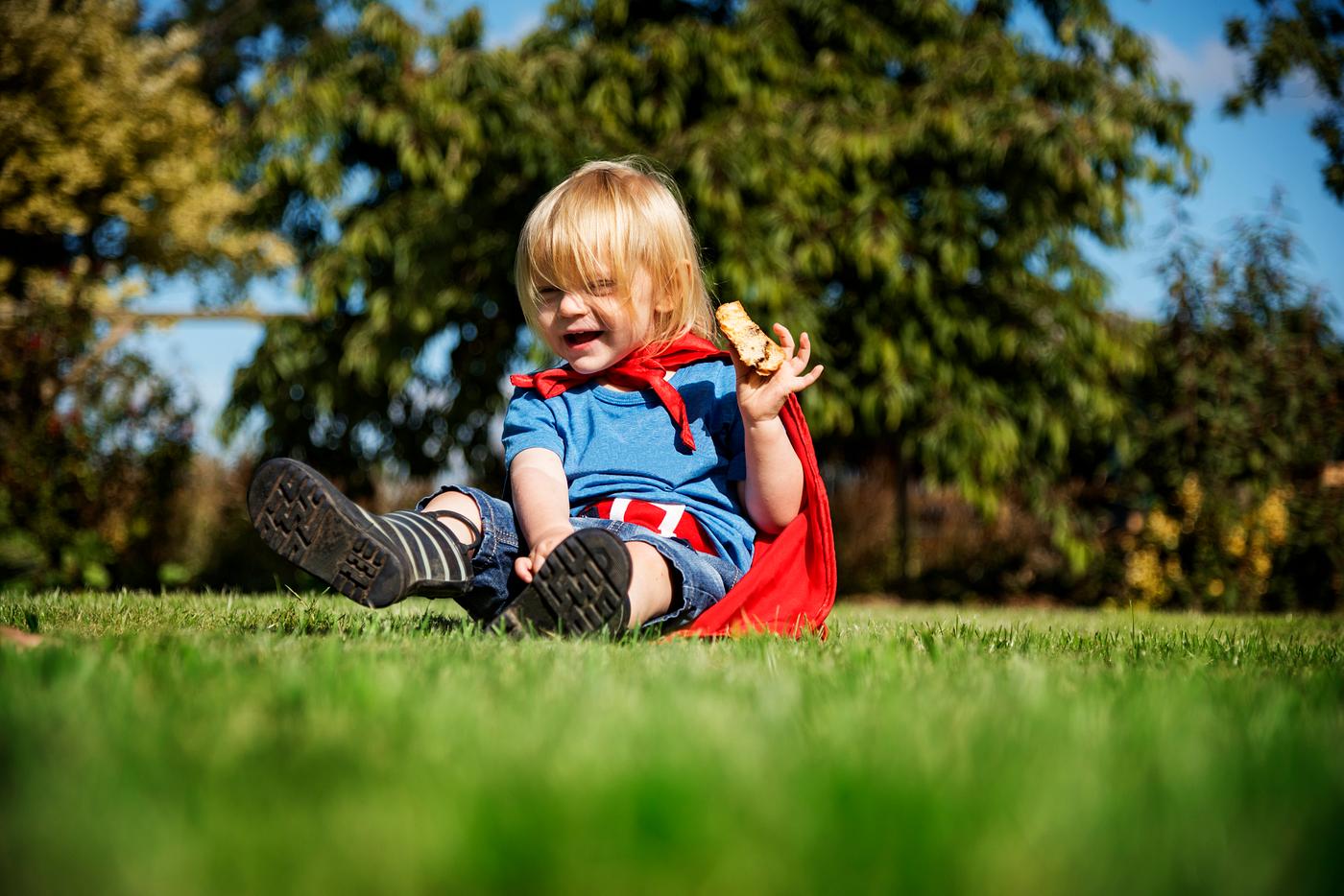 Little boy wearing superhero costume playing in a park - grass, child, young, active, activity, adorable, aspirations, boy,... Little boy wearing superhero costume playing in a park - grass, child, young, active, activity, adorable, aspirations, boy,...