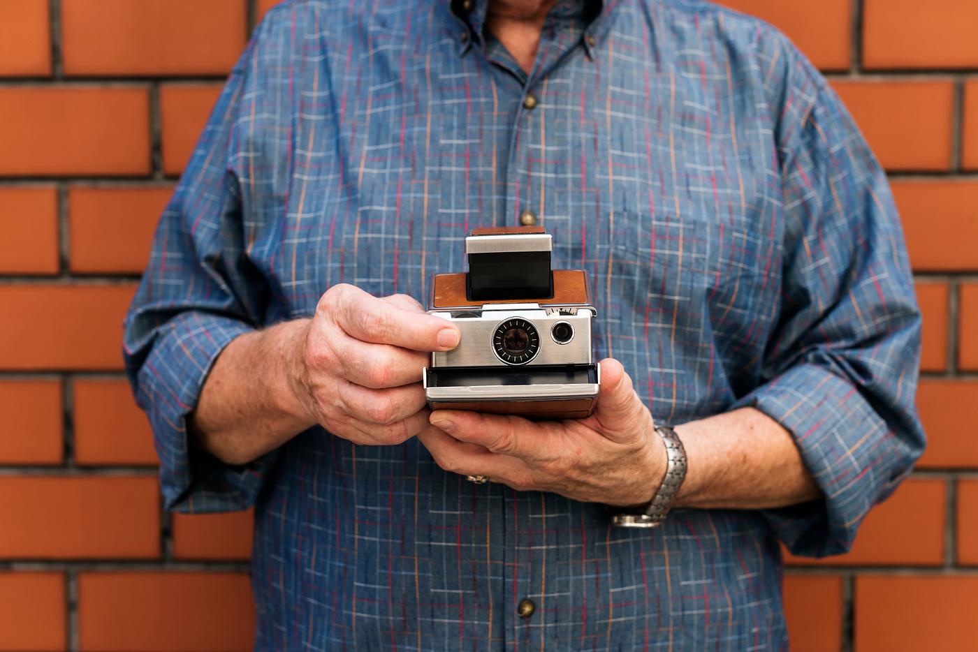holding, brick, camera, hobby, leisure, fun, photography, photographer, wall, man holding, brick, camera, hobby, leisure, fun, photography, photographer, wall, man