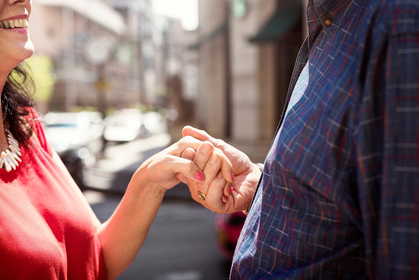 Senior couple holding hands together Senior couple holding hands together