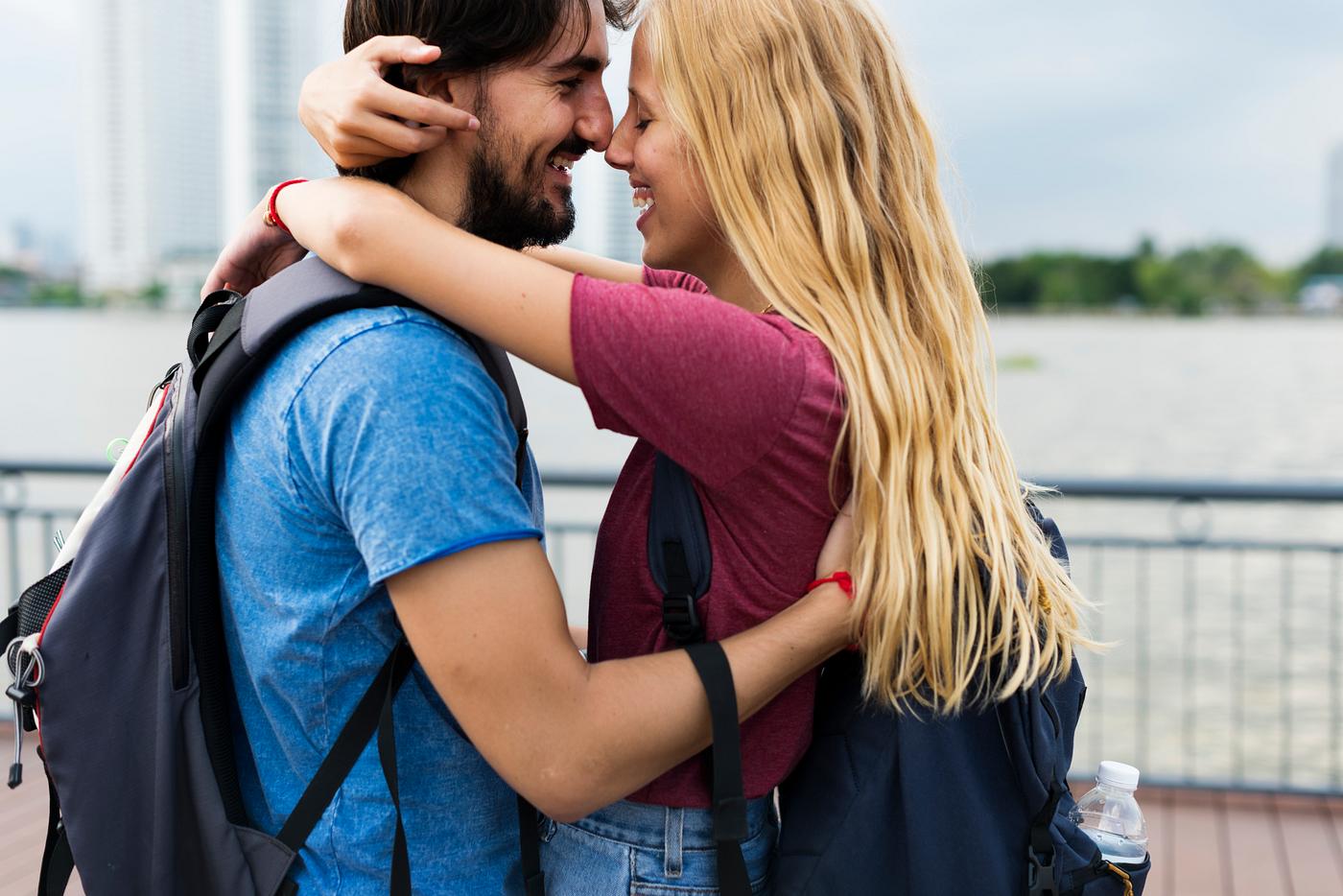 Couple having a sweet time together in an amusement park - couple, beard, smiling, adult, affection, arms, around, blonde,... Couple having a sweet time together in an amusement park - couple, beard, smiling, adult, affection, arms, around, blonde,...