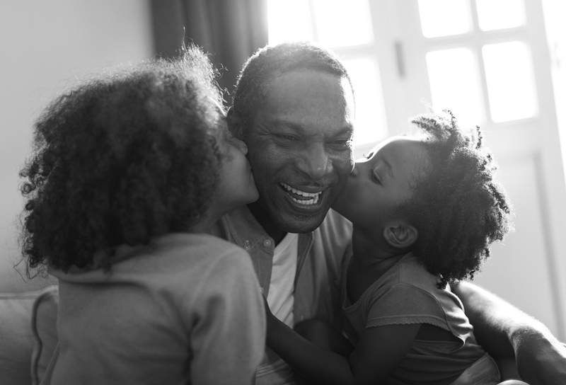 Dad getting kisses from kids African descent family home, kids kissing their father
We are proud to support Hope for Children on their mission to ensure…