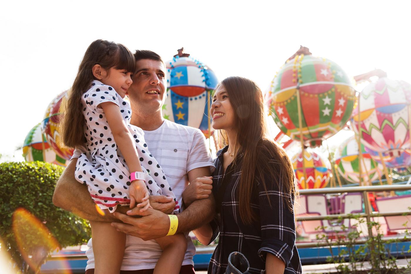 Family enjoying a day at amusement park - leisure activity, bonding, people, kid, love, woman, family, smiling, connection,... Family enjoying a day at amusement park - leisure activity, bonding, people, kid, love, woman, family, smiling, connection,...