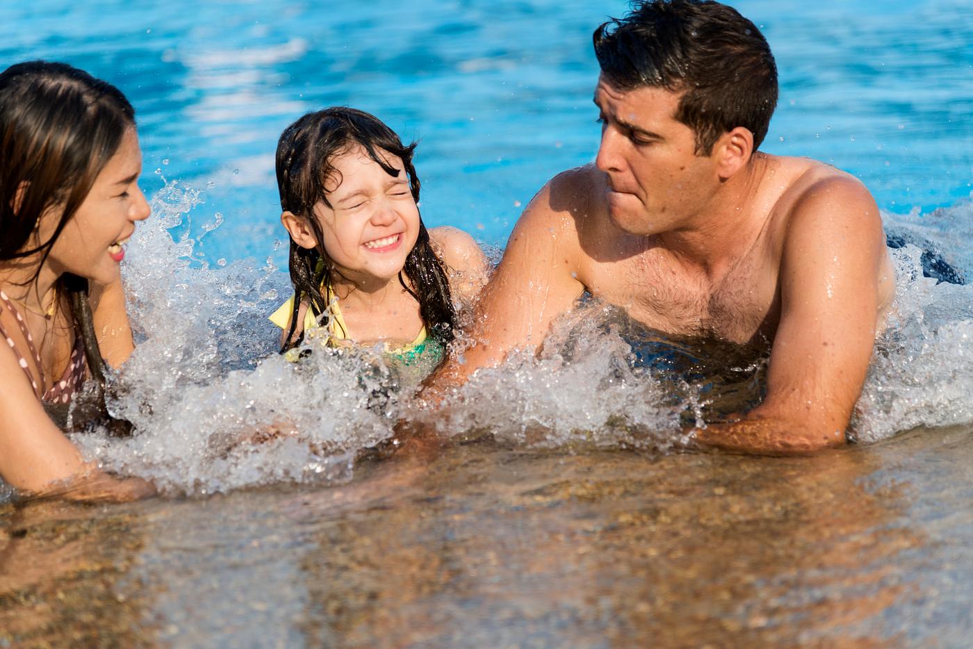 Mixed family enjoying summer pool time Mixed family enjoying summer pool time