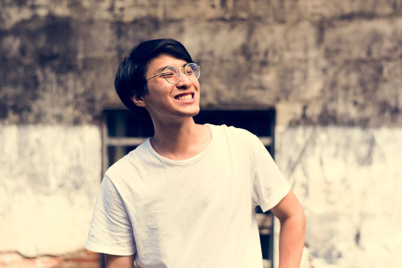 Young Adult Asian Guy Smiling Photoshoot Outdoors Royalty Free