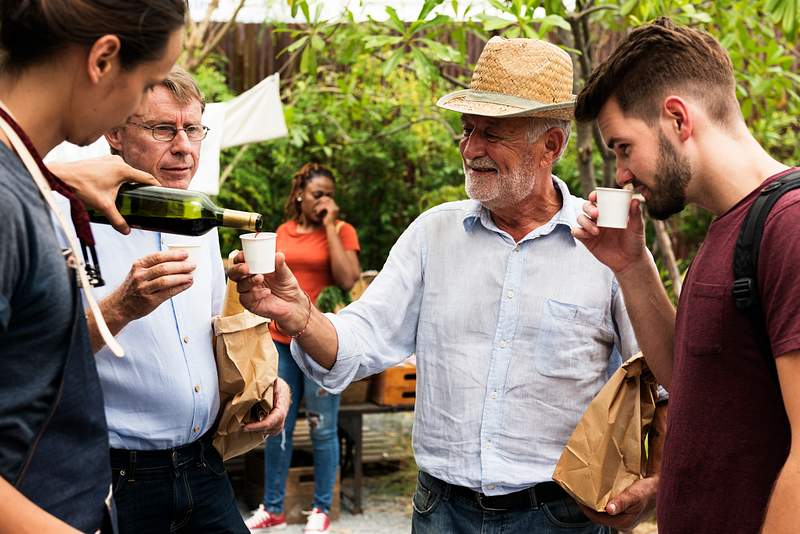 How To Increase Wine Sales In Restaurants - 10 Practical Tips 4 Man Offering Red Wine to Customer at Food Stall