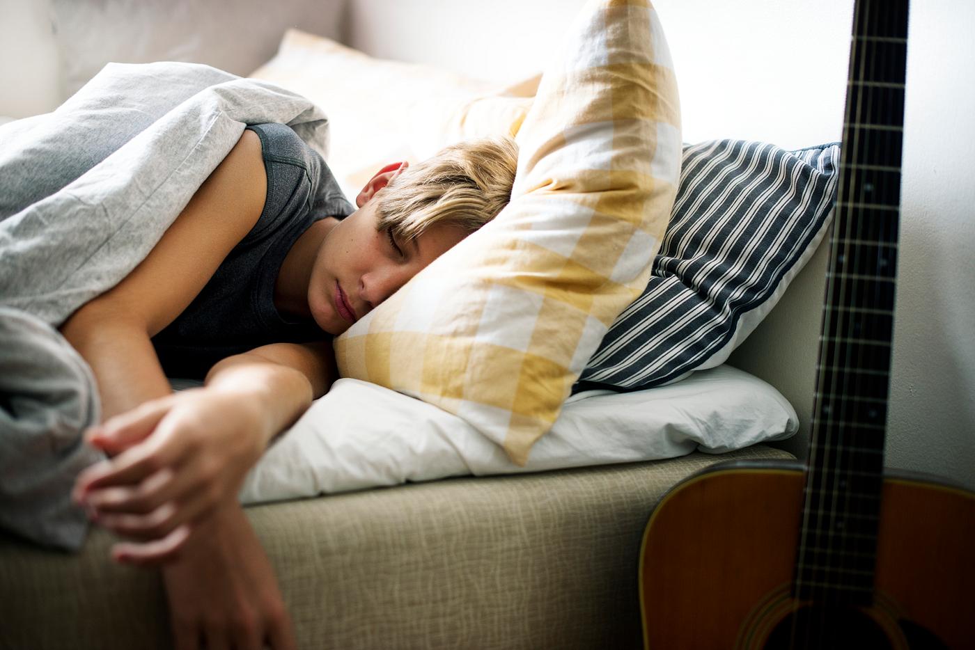 Young caucasian boy sleeping in bed - teenage, adolescence, alone, american, arms stretched, bed, bedroom, blanket, boy,... Young caucasian boy sleeping in bed - teenage, adolescence, alone, american, arms stretched, bed, bedroom, blanket, boy,...