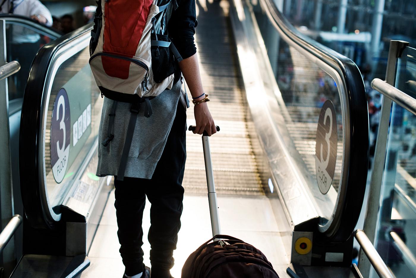 Young caucasian man travel with luggage in the airport Young caucasian man travel with luggage in the airport