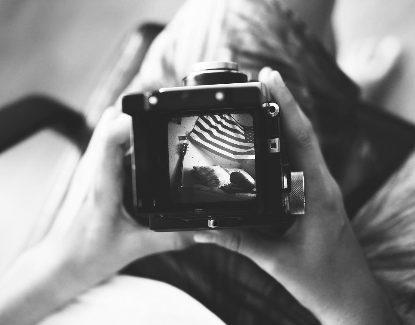 Aerial view of hand holding retro camera grayscale - vintage, holding, camera, snap, retro, caucasian, teenage, grayscale,... Aerial view of hand holding retro camera grayscale - vintage, holding, camera, snap, retro, caucasian, teenage, grayscale,...