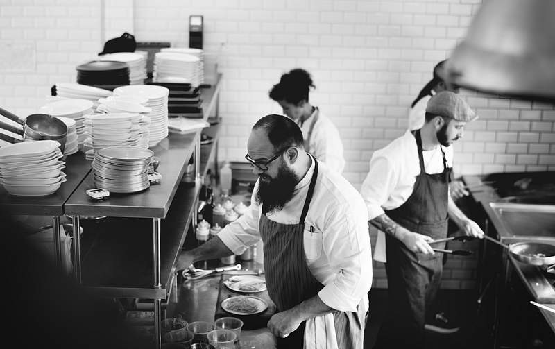 Restaurant Employees | Where To Find The Best And 6 Tips To Improve Recruitment Process 2 Group of chefs working in the kitchen