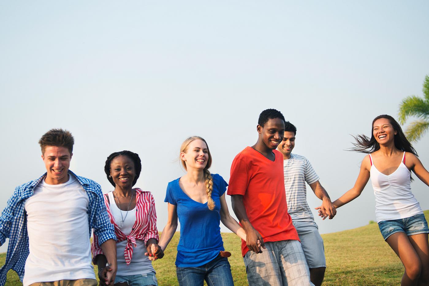 Happy diverse young people - grass, african descent, allies, asian ethnicity, blue sky, casual, celebration, cheerful,... Happy diverse young people - grass, african descent, allies, asian ethnicity, blue sky, casual, celebration, cheerful,...