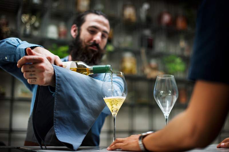 How To Increase Wine Sales In Restaurants - 10 Practical Tips 3 Fancy champagne service at a restaurant