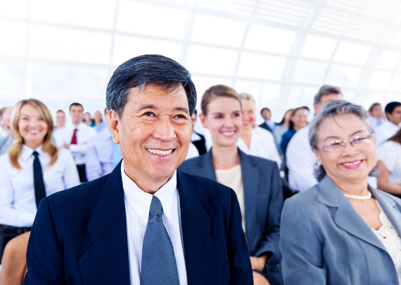 Large group of business people at a conference Large group of business people at a conference