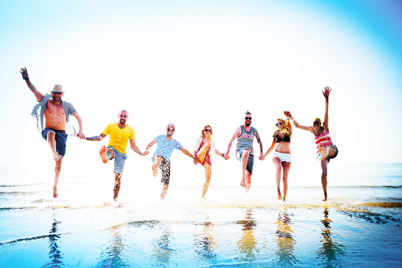 Friends playing in the water at the beach - beach, summer, ocean, nature, hipster, asian ethnicity, action, african descent... Friends playing in the water at the beach - beach, summer, ocean, nature, hipster, asian ethnicity, action, african descent...