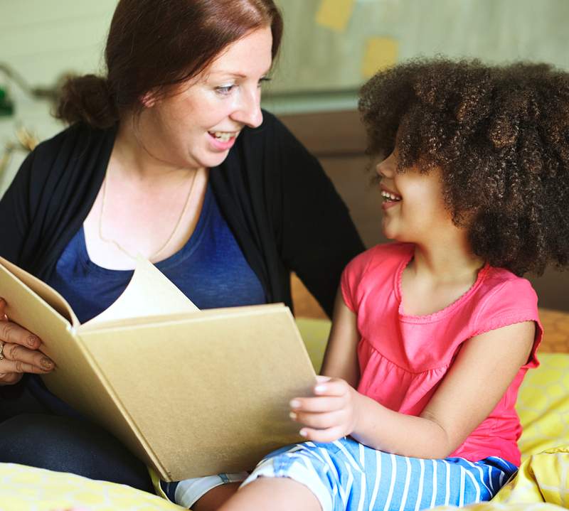 Mother reading to her daughter
