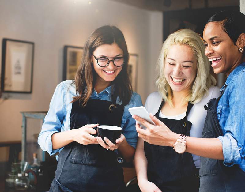 How To Discover Content Ideas For Restaurant Social Media Marketing 6 Baristas watching something funny on a phone