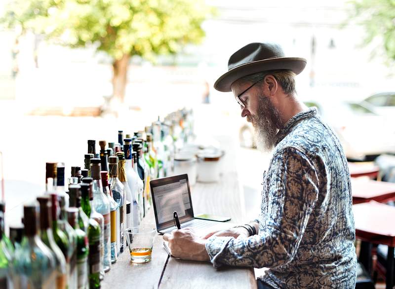 How To Create Effective Restaurant Checklists For 2021? 3 Restaurant owner doing inventory in the bar