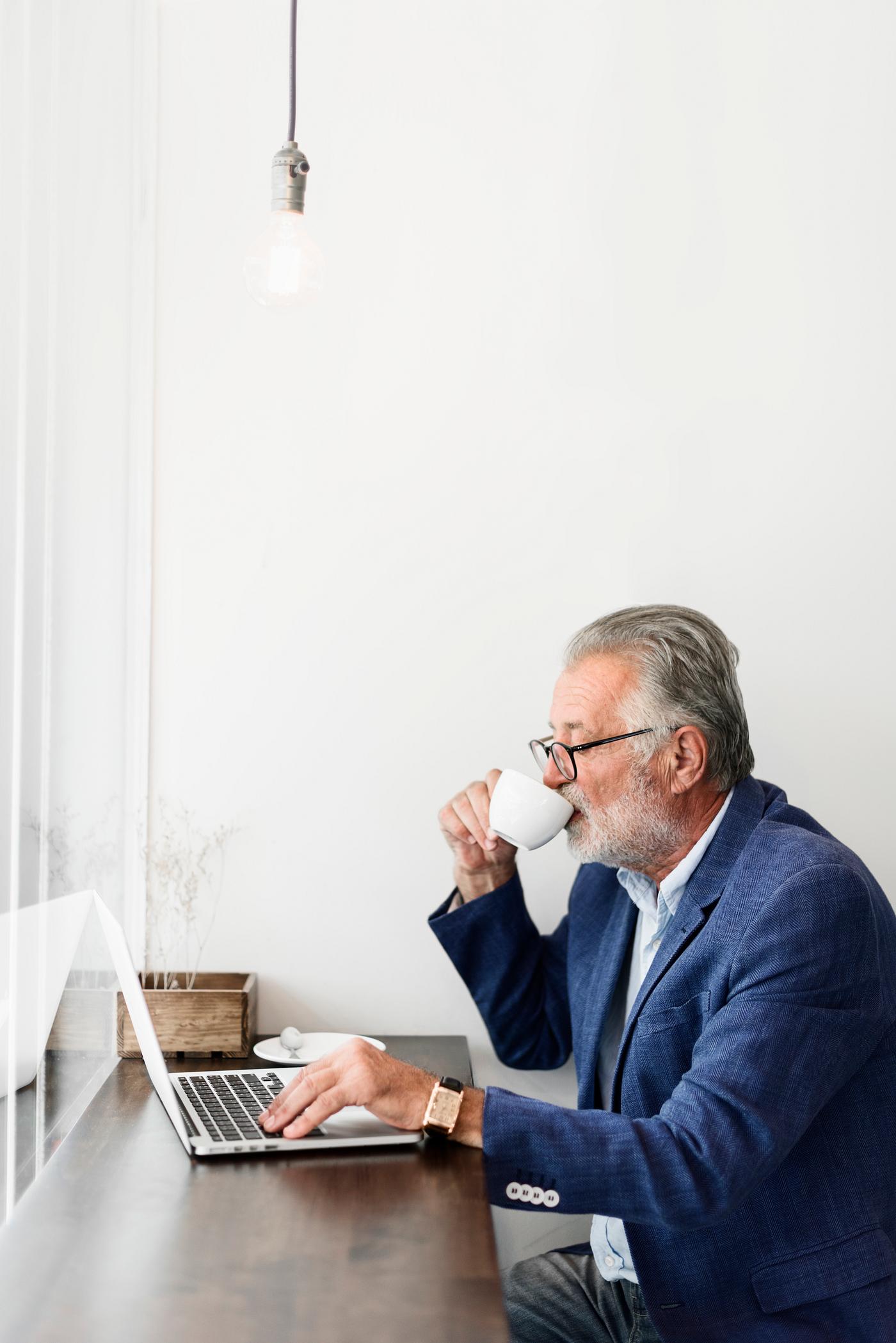 Elderly man is using computer laptop - alone, casual, coffee shop, communication, computer, connection, device, digital,... Elderly man is using computer laptop - alone, casual, coffee shop, communication, computer, connection, device, digital,...