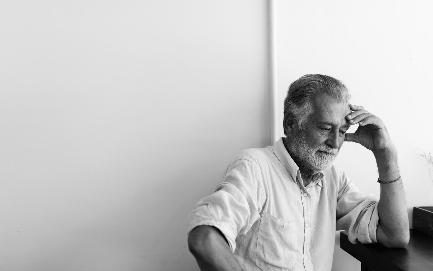 Elderly man is sitting thoughtfully - hipster, alone, beard, black and white, depressed, elderly, emotion, expression, face... Elderly man is sitting thoughtfully - hipster, alone, beard, black and white, depressed, elderly, emotion, expression, face...
