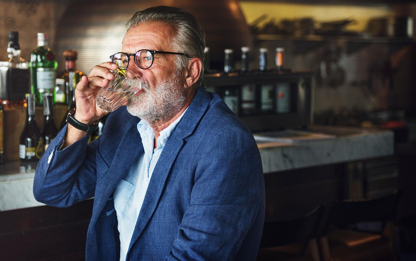 Elderly man is sitting in a pub Elderly man is sitting in a pub