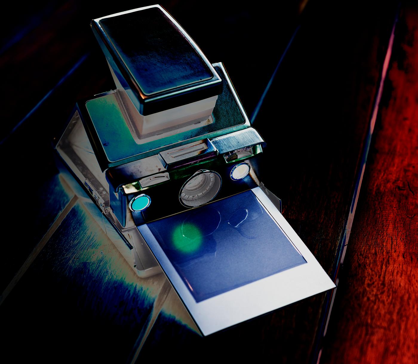 Negative filter on instant camera with film Negative filter on instant camera with film