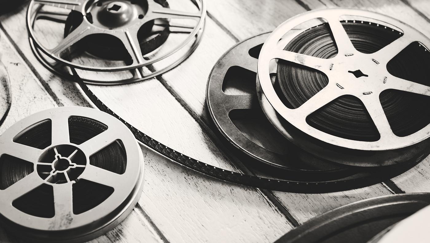 Vintage film strip isolated on wooden floor Vintage film strip isolated on wooden floor