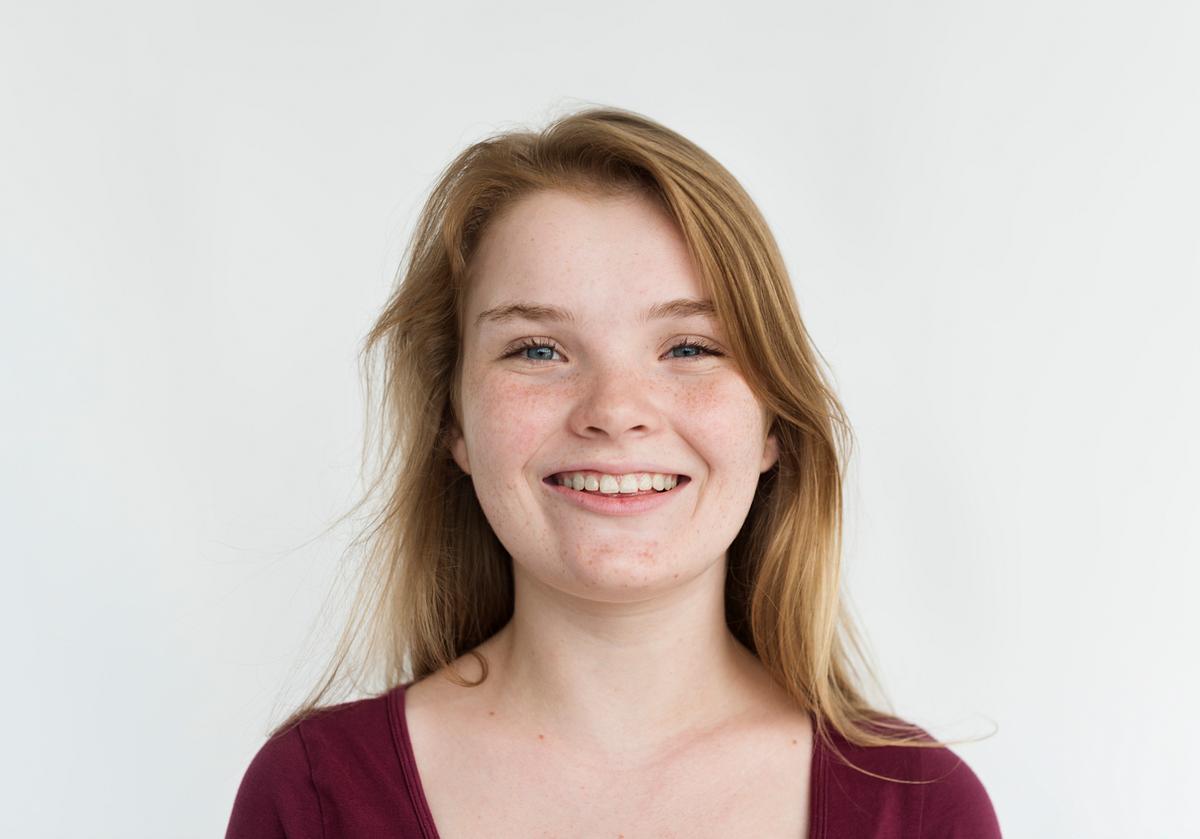 Young Girl Shy Smile Studio Portrait Royalty Free Photo