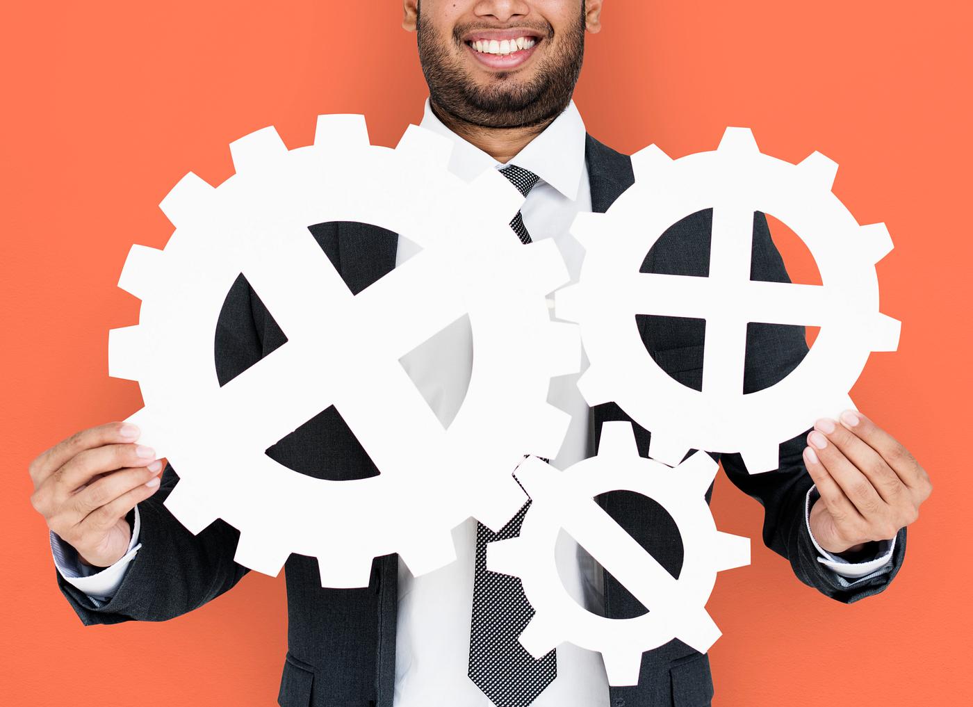 studio, progress, expression, person, holding, people, teamwork, gear, smile, cheerful, smiling, isolated, orange,... studio, progress, expression, person, holding, people, teamwork, gear, smile, cheerful, smiling, isolated, orange,...