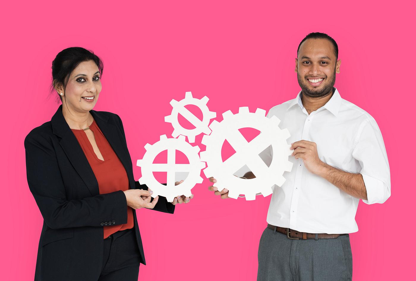 studio, progress, expression, person, holding, people, teamwork, gear, woman, pink, cheerful, smiling, isolated, connection... studio, progress, expression, person, holding, people, teamwork, gear, woman, pink, cheerful, smiling, isolated, connection...
