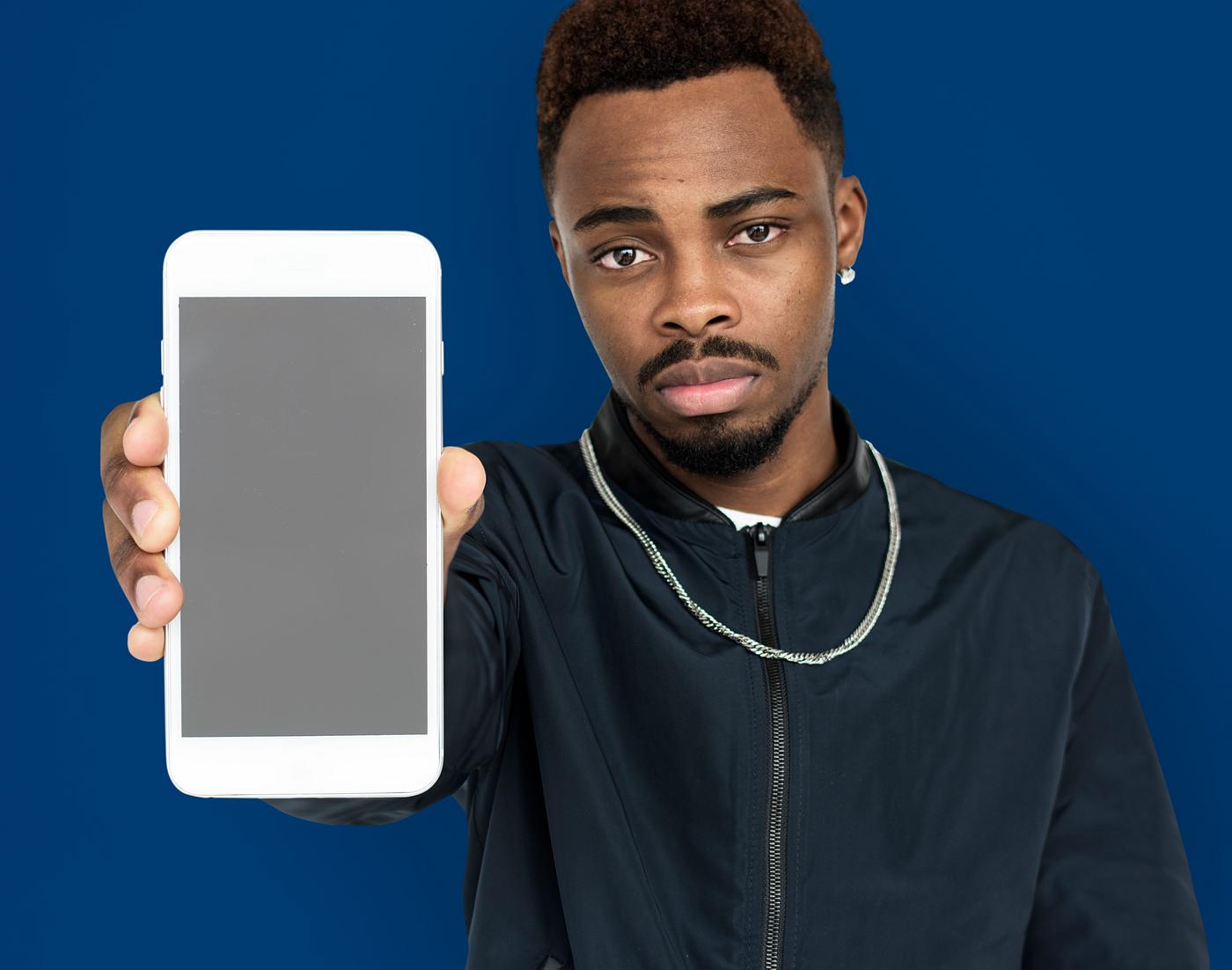 african descent, background, beard, black, blue, communication, device, emotion, expression, focused, holding, holding phone... african descent, background, beard, black, blue, communication, device, emotion, expression, focused, holding, holding phone...