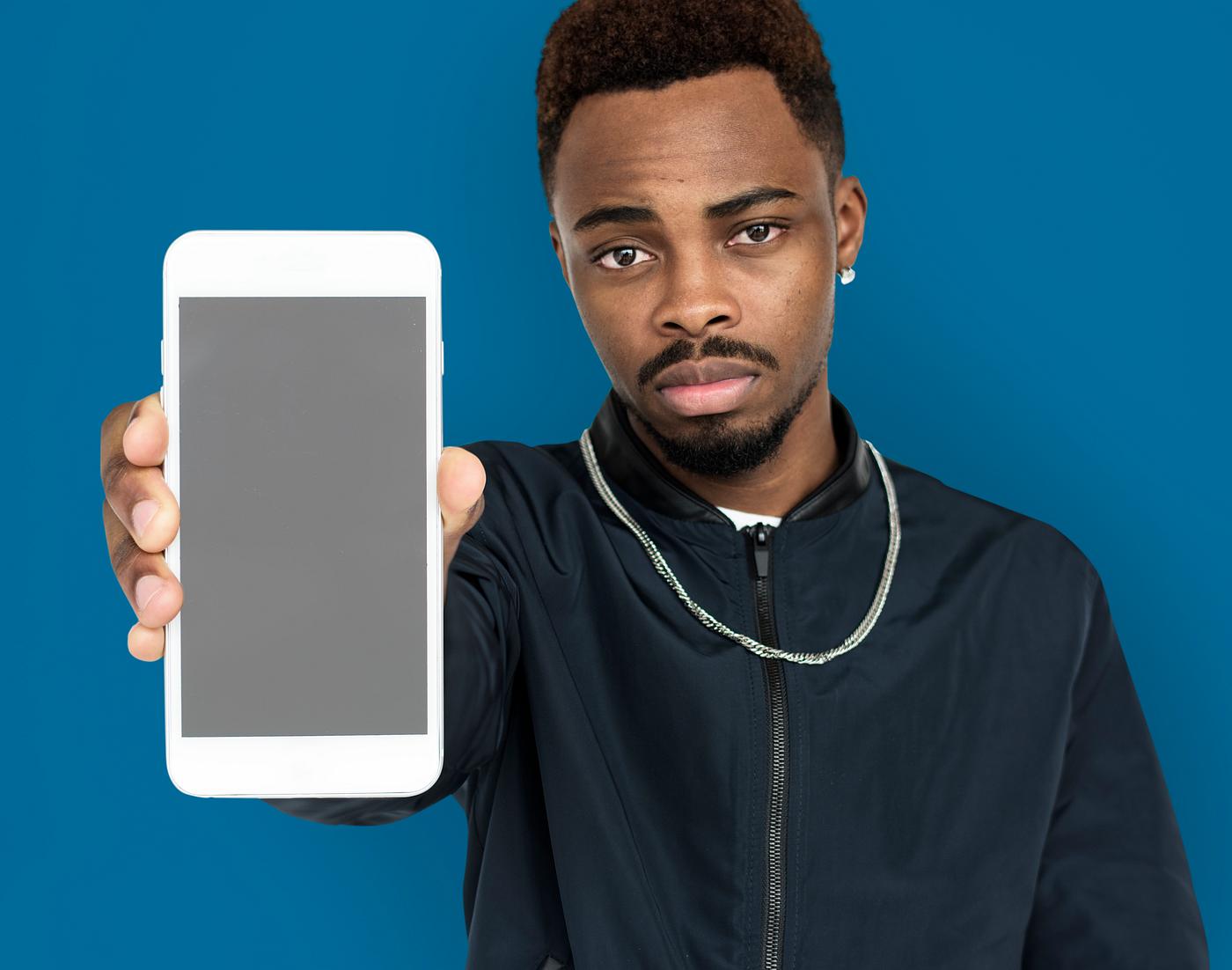 african descent, background, beard, black, blue, communication, device, emotion, expression, focused, holding, holding phone... african descent, background, beard, black, blue, communication, device, emotion, expression, focused, holding, holding phone...