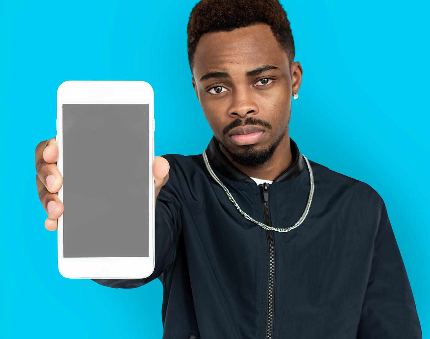 african descent, background, beard, black, blue, communication, device, emotion, expression, focused, holding, holding phone... african descent, background, beard, black, blue, communication, device, emotion, expression, focused, holding, holding phone...