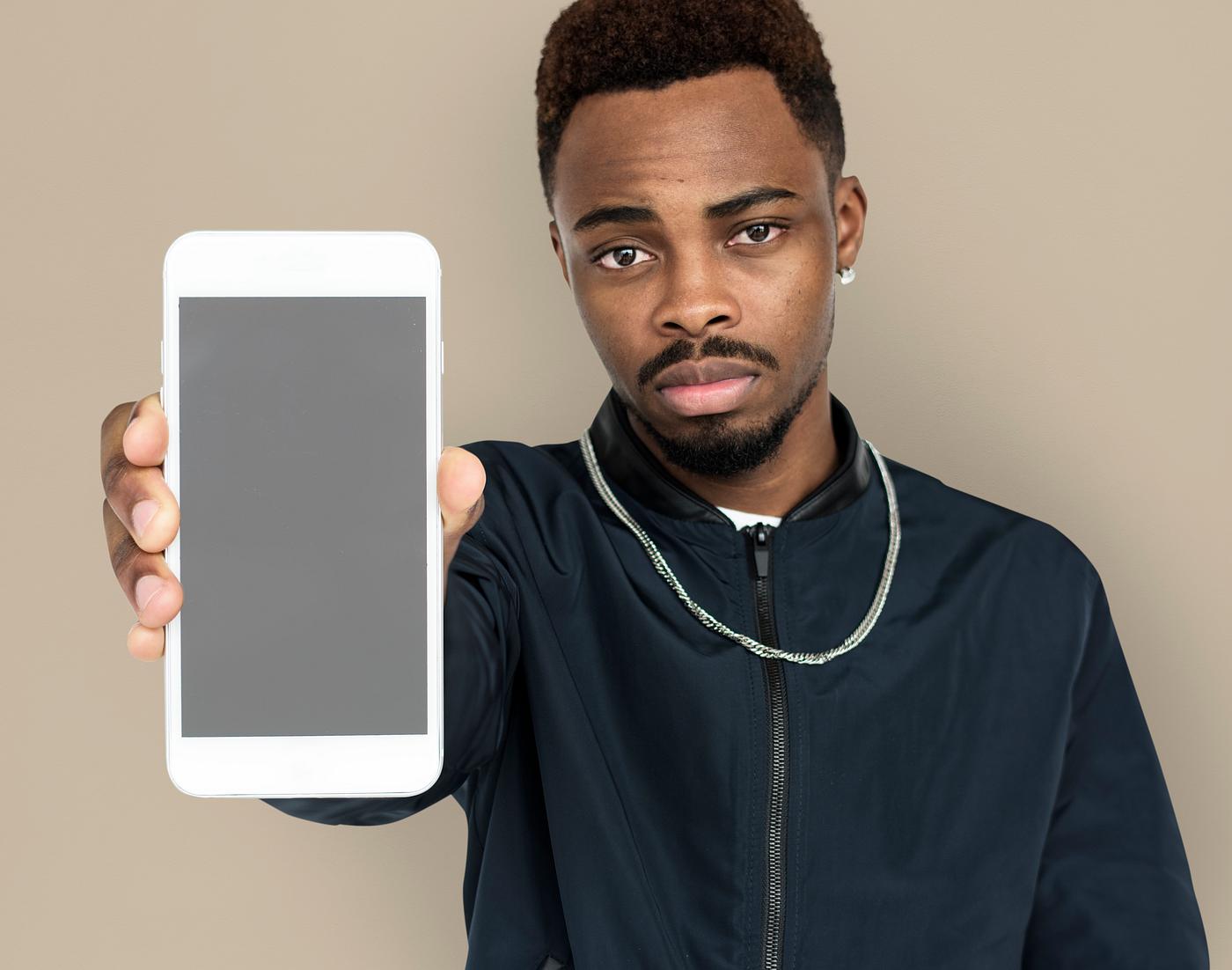 african descent, background, beard, black, brown, communication, device, emotion, expression, focused, holding, holding... african descent, background, beard, black, brown, communication, device, emotion, expression, focused, holding, holding...