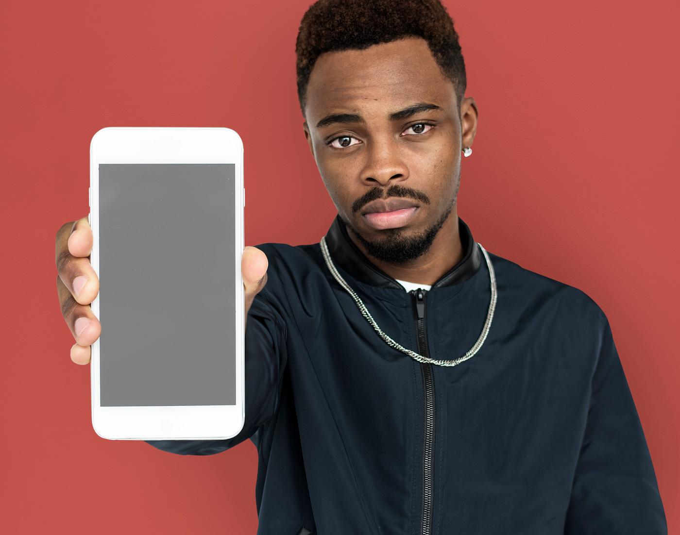 african descent, background, beard, black, brown, communication, device, emotion, expression, focused, holding, holding... african descent, background, beard, black, brown, communication, device, emotion, expression, focused, holding, holding...