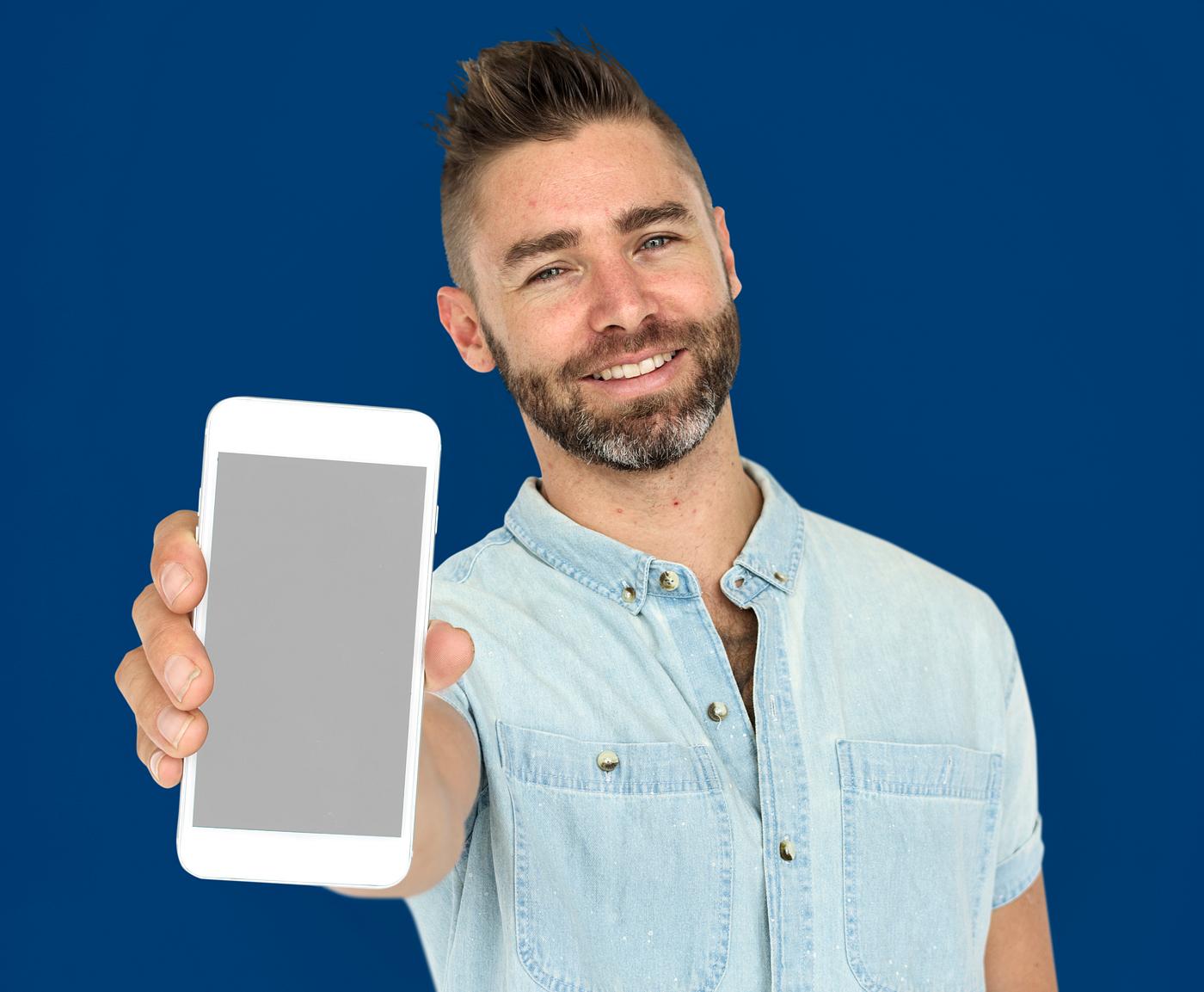 background, beard, blue, caucasian, communication, device, emotion, expression, holding, holding phone, isolated, male, man... background, beard, blue, caucasian, communication, device, emotion, expression, holding, holding phone, isolated, male, man...