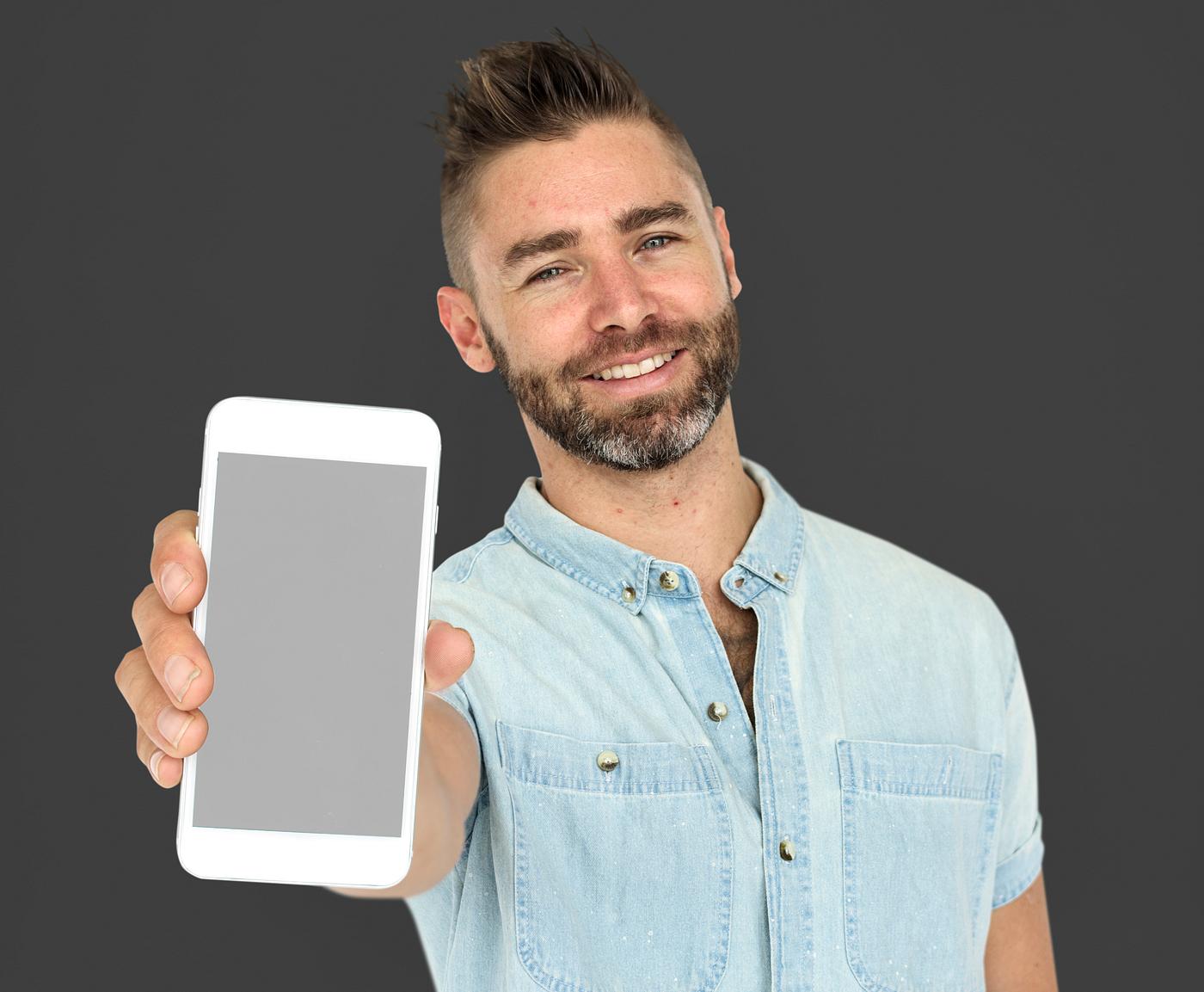 background, beard, caucasian, communication, device, emotion, expression, grey, holding, holding phone, isolated, male, man... background, beard, caucasian, communication, device, emotion, expression, grey, holding, holding phone, isolated, male, man...