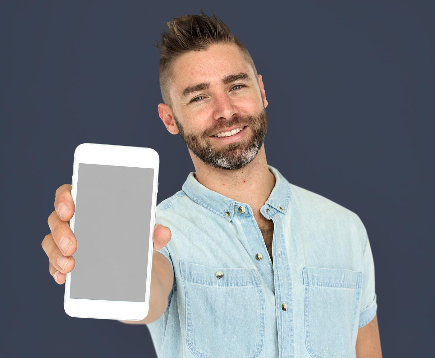 background, beard, blue, caucasian, communication, device, emotion, expression, holding, holding phone, isolated, male, man... background, beard, blue, caucasian, communication, device, emotion, expression, holding, holding phone, isolated, male, man...