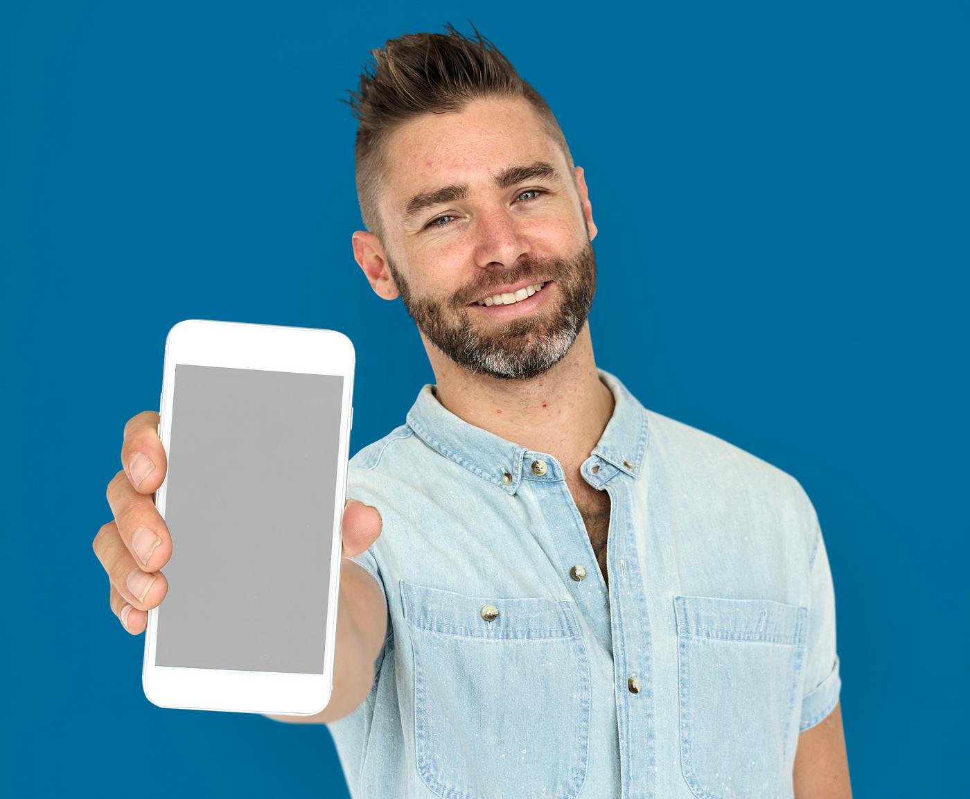background, beard, blue, caucasian, communication, device, emotion, expression, holding, holding phone, isolated, male, man... background, beard, blue, caucasian, communication, device, emotion, expression, holding, holding phone, isolated, male, man...