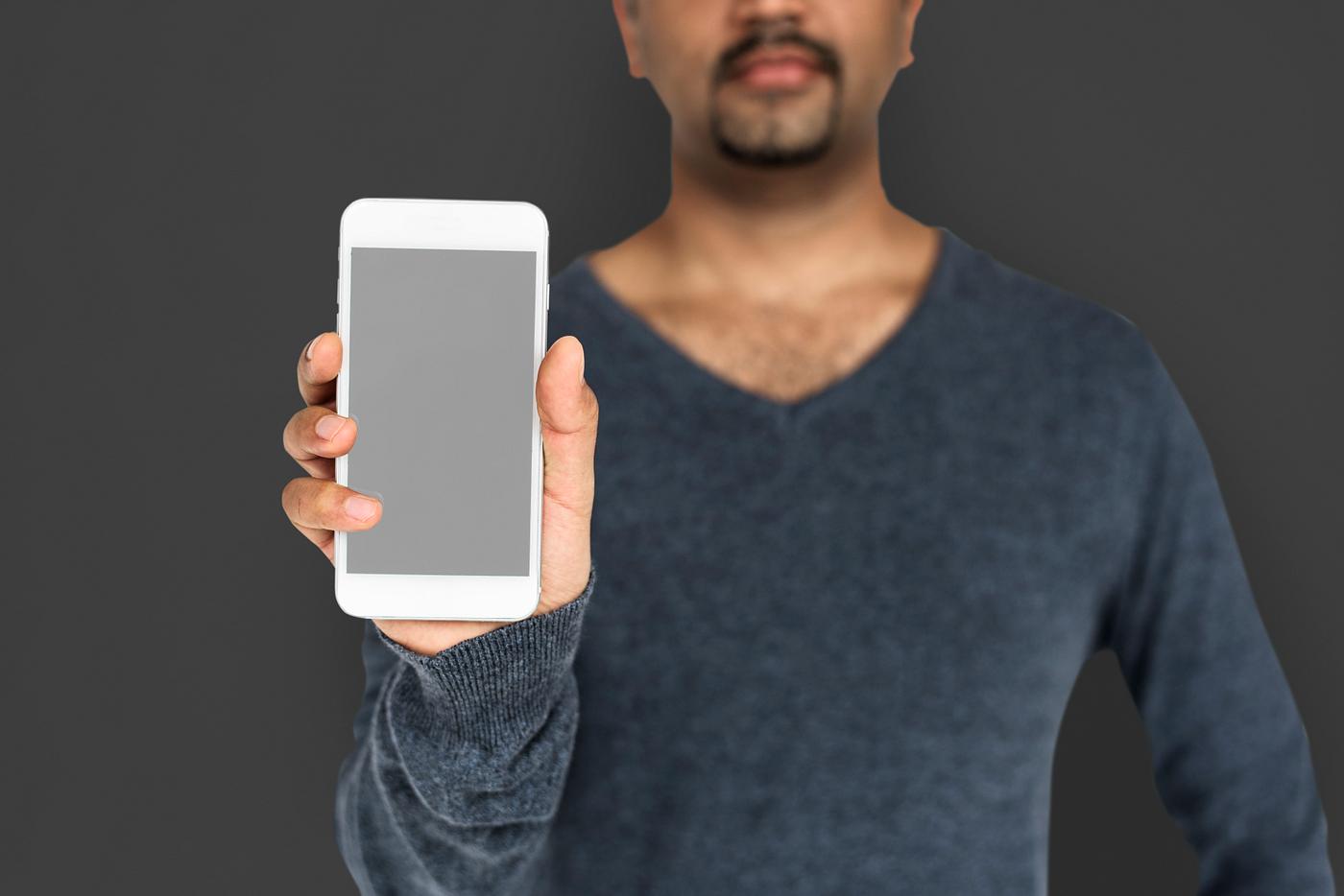 african descent, background, beard, black, communication, device, emotion, expression, focused, grey, holding, holding phone... african descent, background, beard, black, communication, device, emotion, expression, focused, grey, holding, holding phone...
