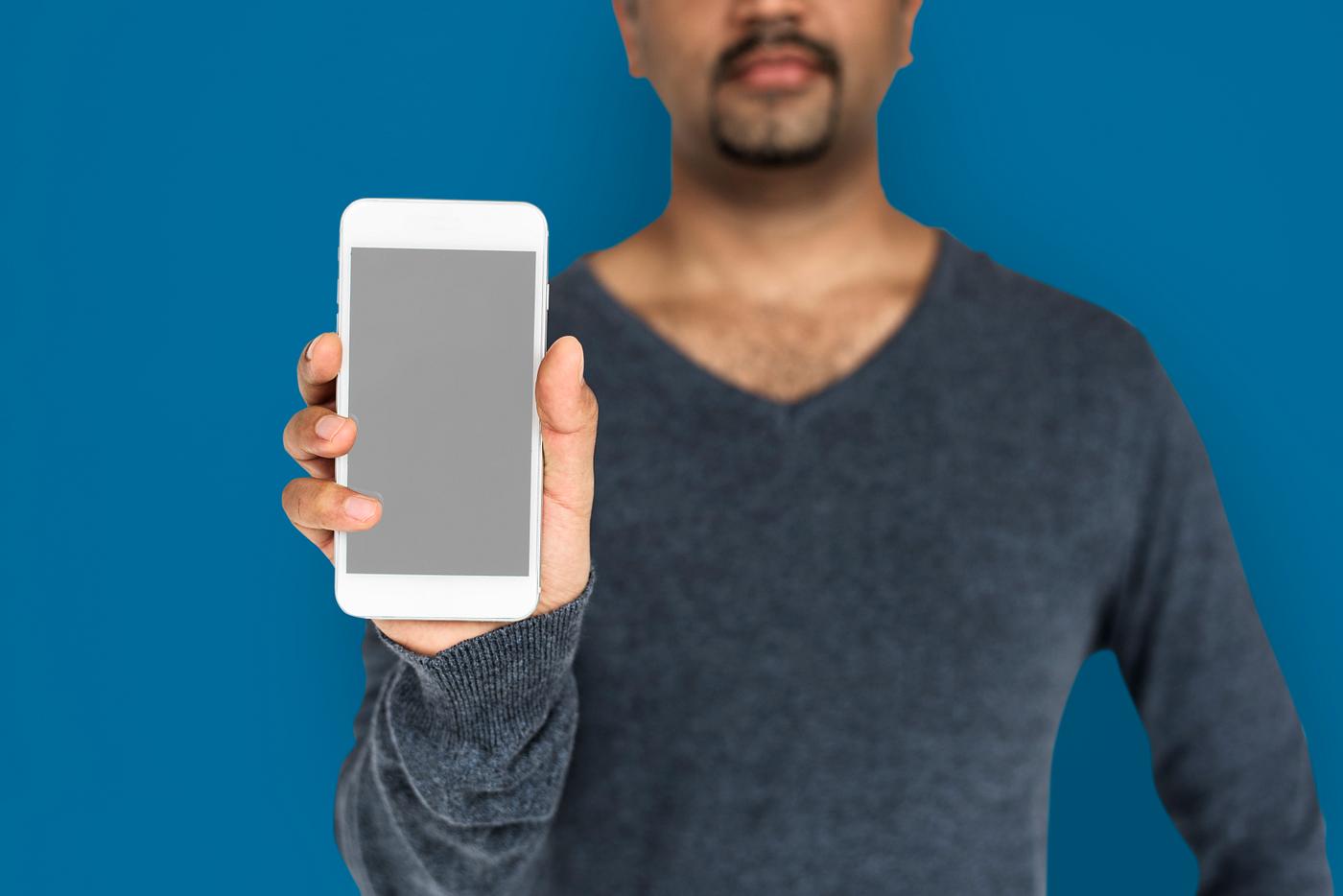 african descent, background, beard, black, blue, communication, device, emotion, expression, focused, holding, holding phone... african descent, background, beard, black, blue, communication, device, emotion, expression, focused, holding, holding phone...