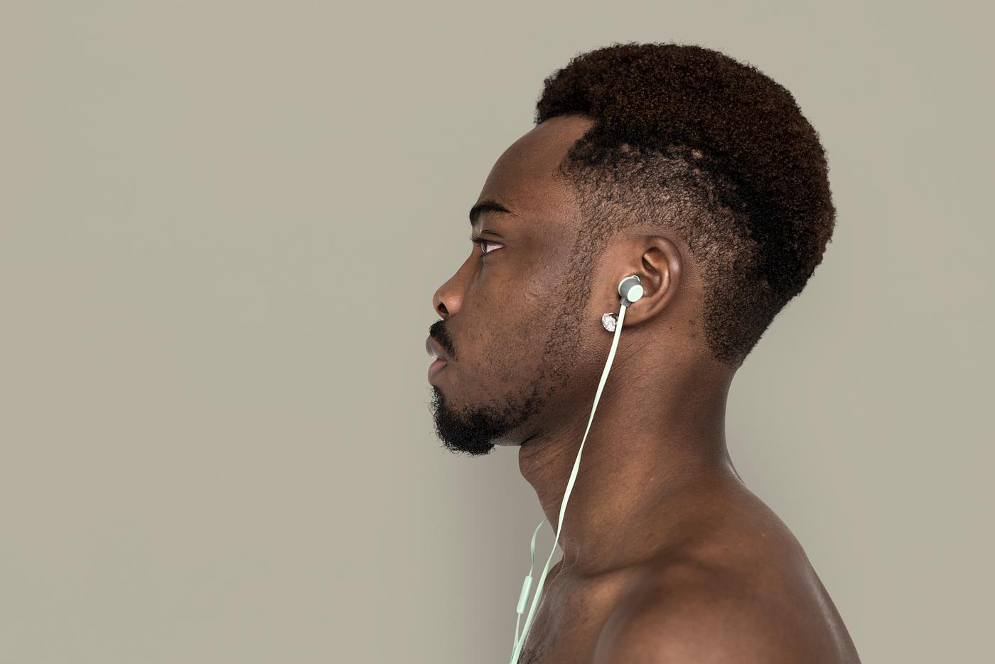 african, african descent, music, listening, music player, serious, man, isolated, studio, studio shoot, side view, earphones... african, african descent, music, listening, music player, serious, man, isolated, studio, studio shoot, side view, earphones...