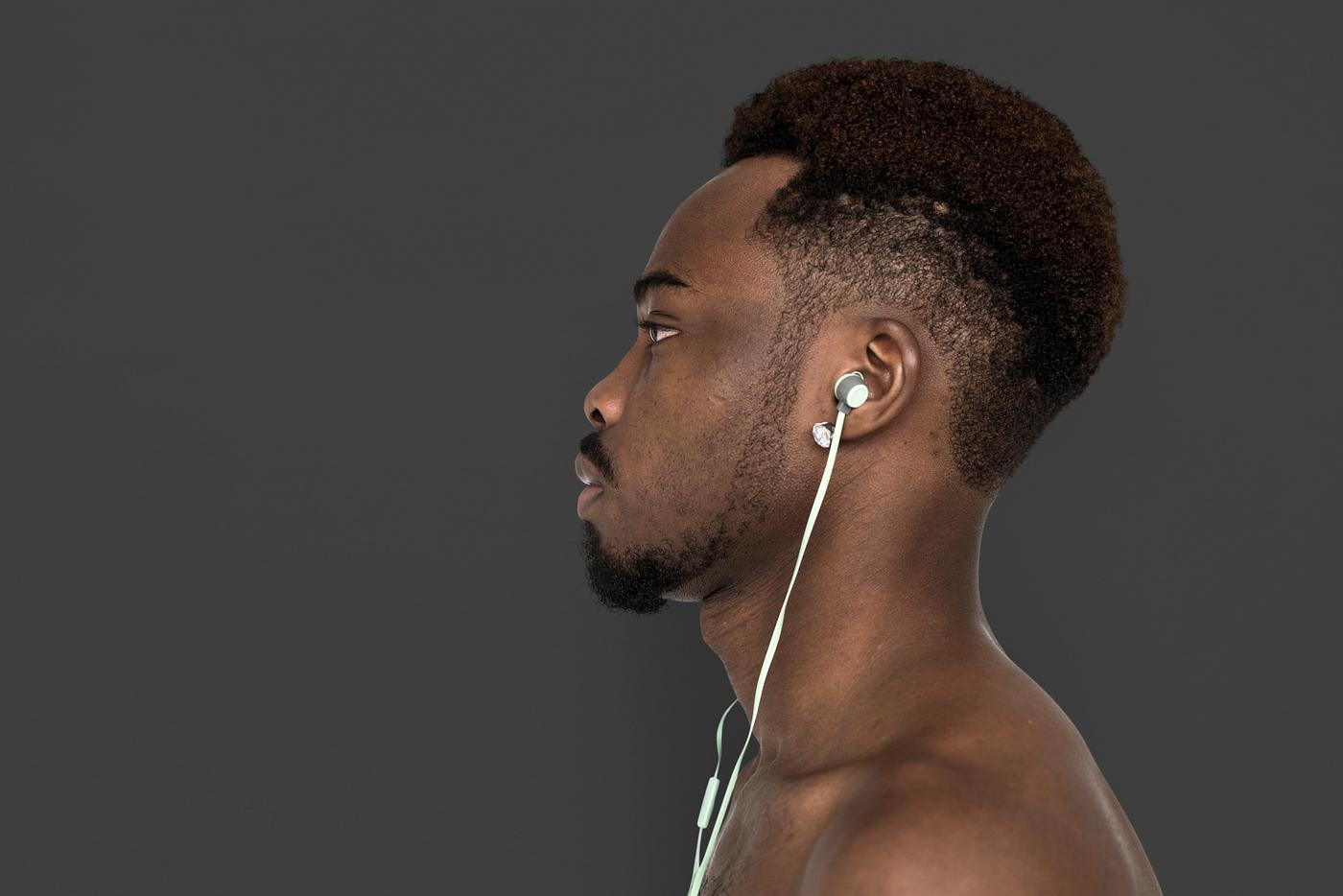 african, african descent, music, listening, music player, serious, man, isolated, studio, studio shoot, side view, earphones... african, african descent, music, listening, music player, serious, man, isolated, studio, studio shoot, side view, earphones...