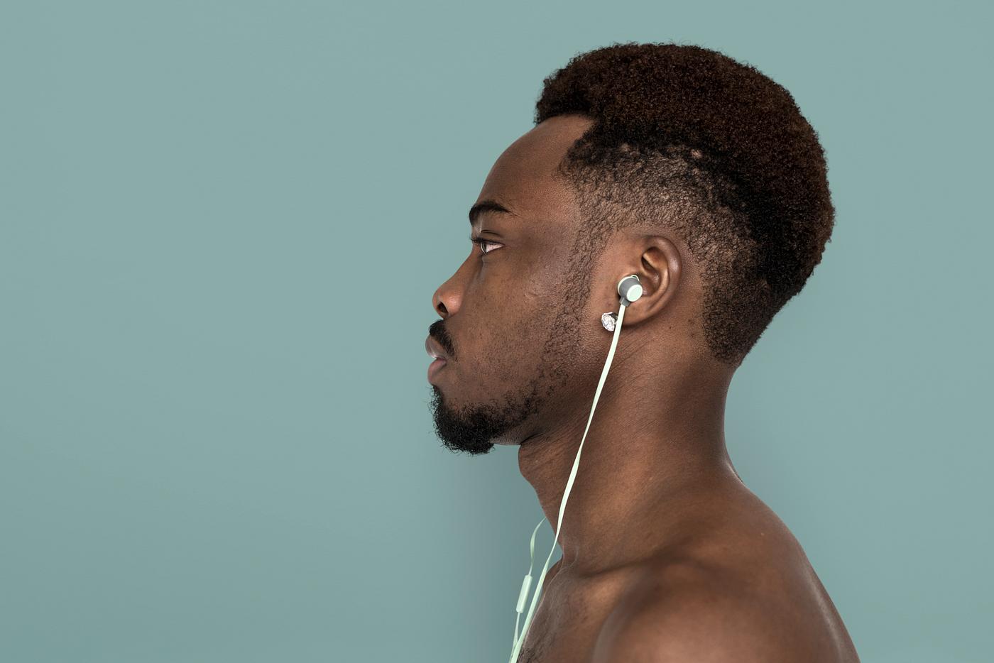 african, african descent, music, listening, music player, serious, man, isolated, studio, studio shoot, side view, earphones... african, african descent, music, listening, music player, serious, man, isolated, studio, studio shoot, side view, earphones...