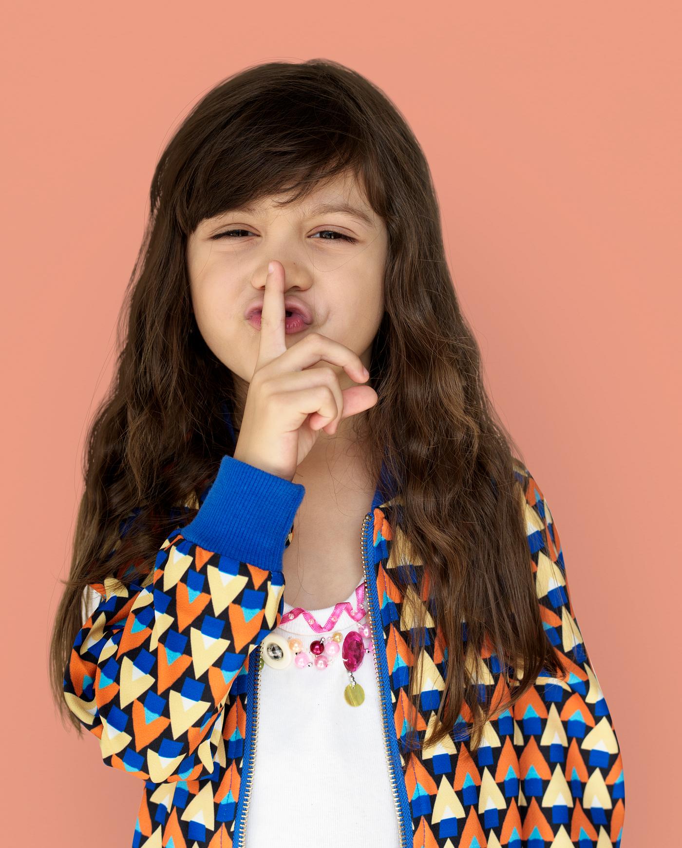 studio, expression, person, people, finger on lips, kid, solo, childhood, shh, smile, cheerful, smiling, orange, isolated,... studio, expression, person, people, finger on lips, kid, solo, childhood, shh, smile, cheerful, smiling, orange, isolated,...